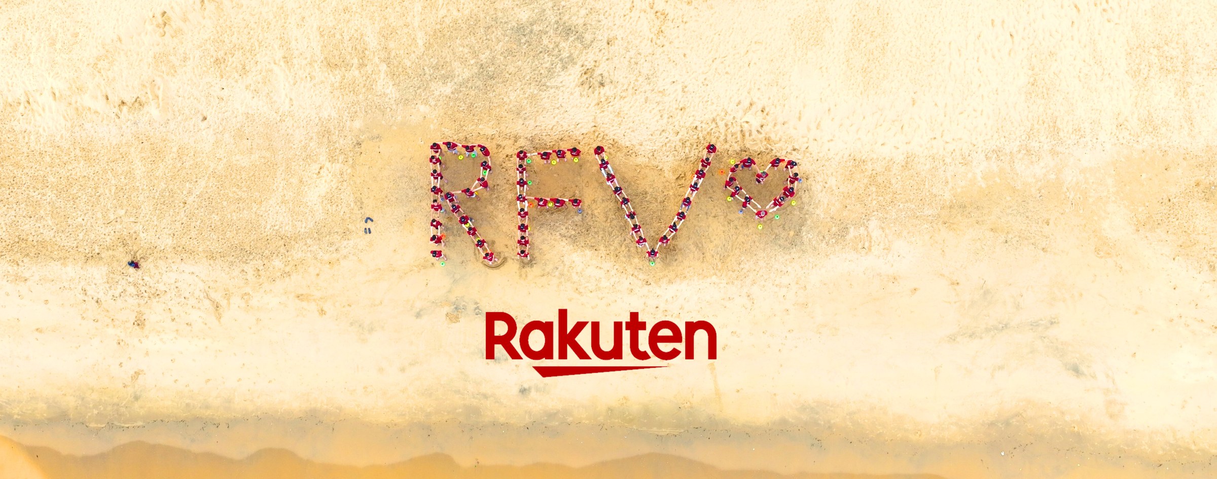 Rakuten Fintech Vietnam team forming RFV on the beach
